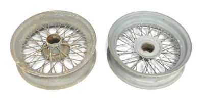 A pair of wheel alloys, painted in grey, possibly MG, 44cm diameter.
