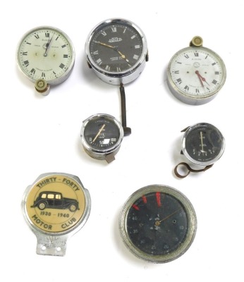 A group of automobile dials, French marked, oil gauges, a British Jaegar eight day gauge, and a 3040 Motor Club 1930-40 car badge. (1 tray)