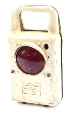 A railway carrying inspection lamp, in white Bakelite case with modern British Rail symbol, 41cm high, 19cm wide.