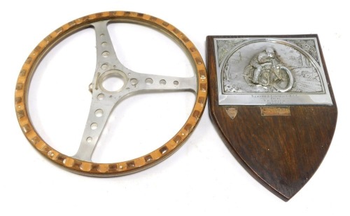A motorcycle racing plaque for Newark & District MCC Club, won by R H Smith, 28/11/26, and a further presentations, silver plated on a oak shield mount, together with a steering wheel. (2)