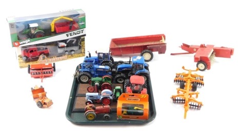 Diecast agricultural vehicles, to include New Holland Tractor, Ford tractors, Massey Harris tractors, Matchbox No 27 grain harvester, Burago Fendt tractor & trailer, ploughs, etc. (1 tray plus)