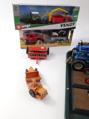 Diecast agricultural vehicles, to include New Holland Tractor, Ford tractors, Massey Harris tractors, Matchbox No 27 grain harvester, Burago Fendt tractor & trailer, ploughs, etc. (1 tray plus) - 2