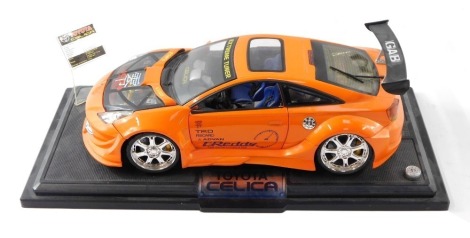 A diecast Toyota Celica model car, on plinth.