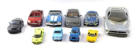 A group of diecast vehicles, to include a Solido Renault Megane, a Tin Toys yellow car, Aston Martin, Maisto blue Mustang, 1:18 scale, Motormax BMW 7 series, Burago Alpine A110, and a Maisto Jaguar XJ220, 1:12 scale. (1 tray 1 car)