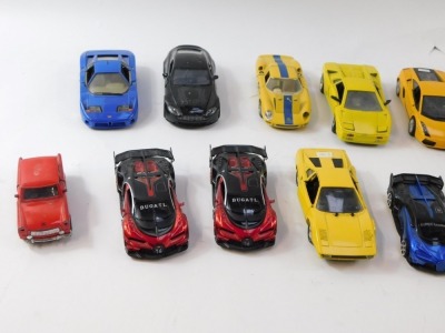 A group of diecast model vehicles, to include Motormax Lamborghini Gallardo Superleggera, Maisto BMW Z8, Burago Ferrari 250, yellow Lamborghini, Burago Bugatti 11GB, Motormax Aston Martin V12 Vantage, Burago Rolls Royce Camargue, and a Burago Ferrari GTO. - 2