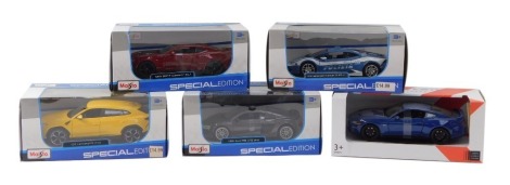 A group of diecast vehicles, 1:24 scale, comprising Maisto Lamborghini Hurricane LP610-4, John Lewis McLaren, Maisto Audi R8 V10 Plus, Maisto 2017 Camaro, and a Maisto Lamborghini Urus, boxed. (5)