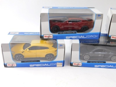 A group of diecast vehicles, 1:24 scale, comprising Maisto Lamborghini Hurricane LP610-4, John Lewis McLaren, Maisto Audi R8 V10 Plus, Maisto 2017 Camaro, and a Maisto Lamborghini Urus, boxed. (5) - 2