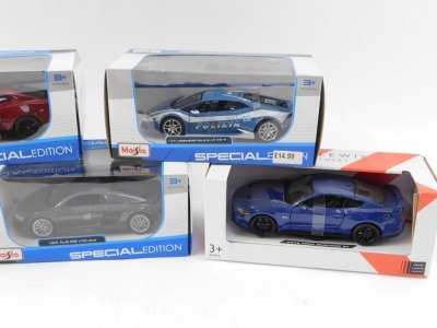 A group of diecast vehicles, 1:24 scale, comprising Maisto Lamborghini Hurricane LP610-4, John Lewis McLaren, Maisto Audi R8 V10 Plus, Maisto 2017 Camaro, and a Maisto Lamborghini Urus, boxed. (5) - 3