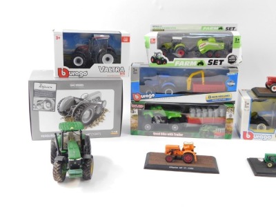 Agricultural diecast vehicles, to include Burago Valtra N174, a Sun Toys metal farm set, Ferguson TEA2-0 with track, 1:16 scale, a Burago New Holland Agricultural blue tractor, John Deere miniature tractors, Toyland figures, Burago New Holland Agricultura - 2