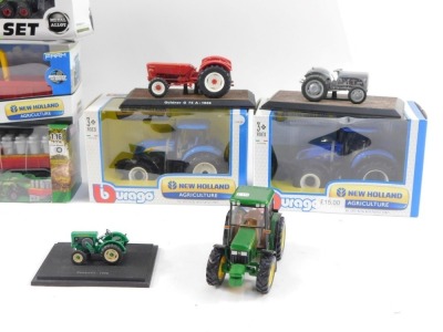 Agricultural diecast vehicles, to include Burago Valtra N174, a Sun Toys metal farm set, Ferguson TEA2-0 with track, 1:16 scale, a Burago New Holland Agricultural blue tractor, John Deere miniature tractors, Toyland figures, Burago New Holland Agricultura - 3