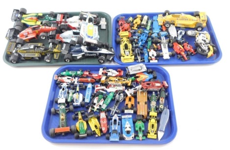 A group of play worn diecast F1 cars, large and medium sized, Lotus, Honda, Ferrari, John Players and others. (3 trays)