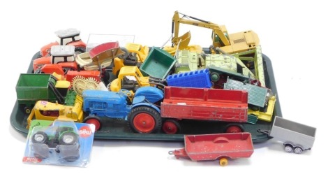 Play worn Dinky and other diecast vehicles, agricultural diggers, tractors, trailers, etc. (1 tray)