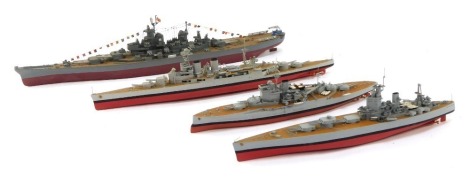 Four kit built warships, comprising two long models and two shorter models. (4)