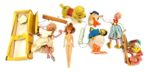 Puppets, comprising a Pelham Puppet of a lady, Donald Duck puppet and others, 1 boxed. (AF)