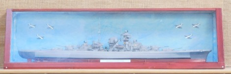 A kit built Bismark model, ship in a glazed display case, 42cm high, 138cm wide, 33cm deep.