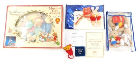 Royal Doulton Bunnykins wares, comprising a musical cot mobile, boxed, cased Bunnykins plush, and Blankie. (3)
