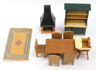 A small group of wooden doll's house furniture, comprising log burner, dresser, rug, high chair, dining table and five chairs. (10) - 3