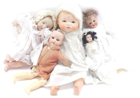 Four bisque headed dolls, comprising one stamped AM, another No 6789/20, an Armand Marseilles 390 AON, and another unmarked. (4)