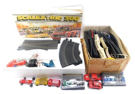 A Scalextric 300 cased set, additional Scalextric track, cased vehicles, C129 and C131, etc. (2 boxes)