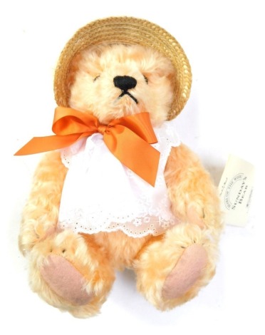 A Steiff pink Teddy Bear, with bow and sun hat, part of Danbury Mint Sunday Bears range, with tag.