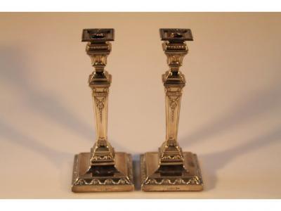 A pair of Edward VII silver candlesticks by Walker and Hall