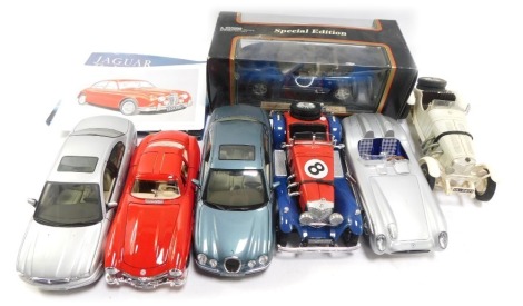 Diecast collector's cars, Maisto Jaguar XK8, Maisto Jaguar S Type, Jaguar S Type 2001, Burago Mercedes Benz, Burago Mercedes Benz 300SLR, Mercedes Benz SSK, and Mercedes Benz 300SL, one boxed, and Jaguar Legends book. (2 trays and book)