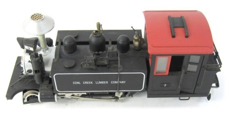 A Bachmann coal creek G scale locomotive, in black.