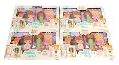 Four wooden dress up dolls sets.