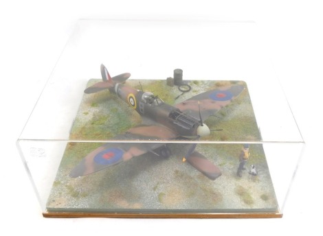 A diorama model of a Spitfire MKV, 1:32 scale, in perspex display case, 34cm high, 43cm wide, 43cm deep.