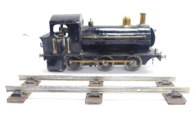 A tin plate locomotive, black livery, with track. - 3