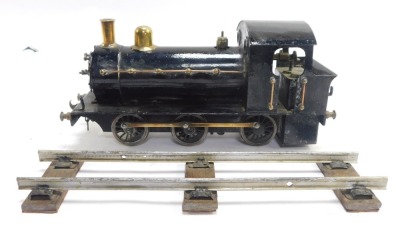 A tin plate locomotive, black livery, with track. - 4