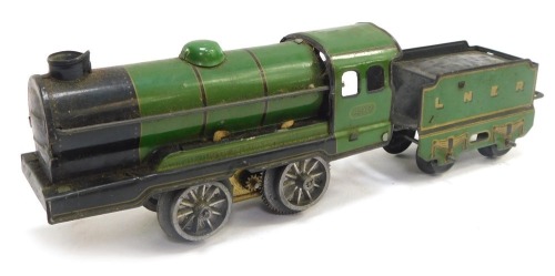 A tin plate locomotive and tender, carriage number 490 LNER green livery.