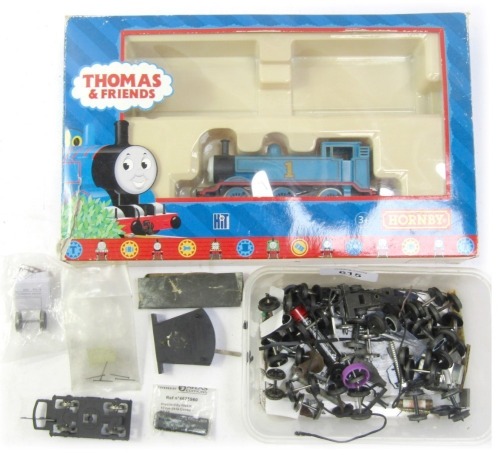 A Hornby Thomas & Friends locomotive and various locomotive parts.