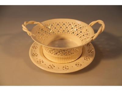 A Leeds creamware pierced dish with rope twist handles on stand