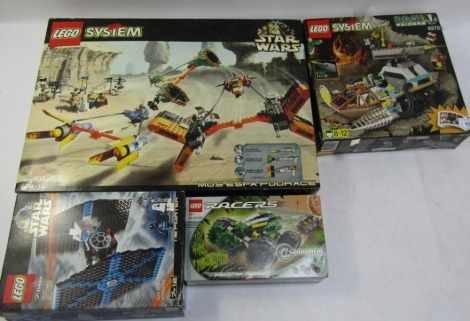 Four Lego sets, comprising a Lego Systems Mosespa Pod Race, Lego Racers Slamoraptor, Lego Systems Rock Raiders, and a Lego Star Wars Tie Fighter, boxed. (4)