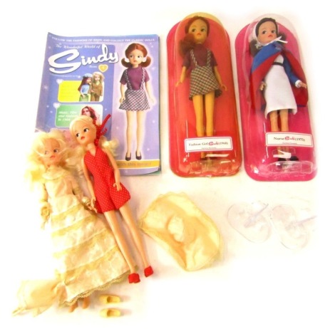 Sindy dolls and magazines, Sindy in red polka dress, Sindy in cream dress, Fashion Girl Sindy in blister pack, Nurse Sindy 1975 in blister pack, and four Sindy magazines. (a quantity)