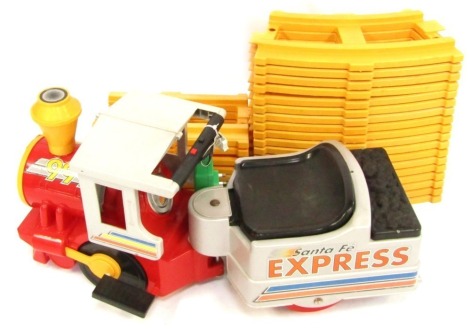 A Peg-Perego Santa Fe Express electric train and track.