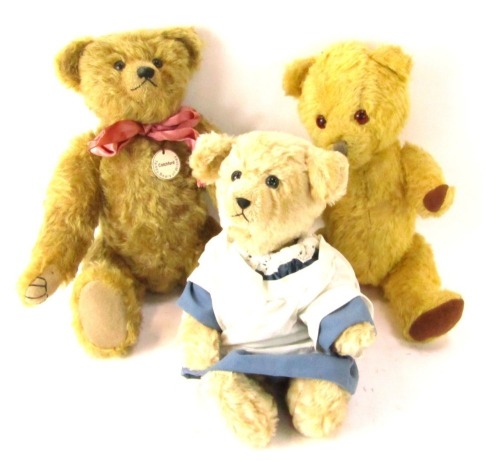 Three blonde plush Teddy bears, comprising a Cotchford Teddy Bears of Whitney bear, Beans of Retford Toys Teddy bear and another in blue dress. (3)