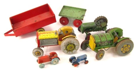 Tin plate agricultural vehicles, comprising a Mettoy clockwork green tractor and Mettoy clockwork yellow tractor, a diecast playworn green tractor and two tin plate trailers. (1 tray)