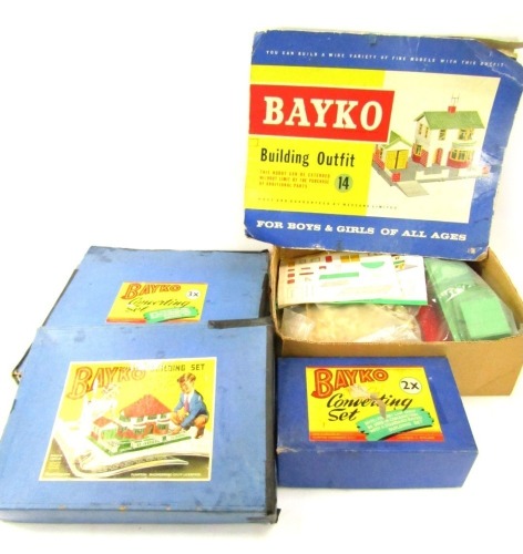 Bayko building sets, comprising converting set two times, the building set for Plumpton Engineering Company Ltd, Liverpool, converting set three times and a Bayko building set outfit 14, all partially boxed. (4)