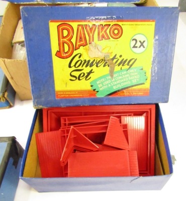 Bayko building sets, comprising converting set two times, the building set for Plumpton Engineering Company Ltd, Liverpool, converting set three times and a Bayko building set outfit 14, all partially boxed. (4) - 5