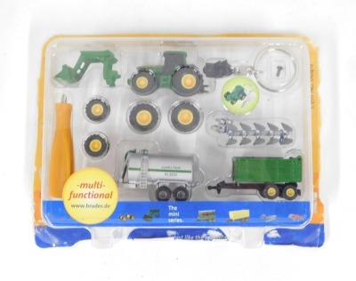 Diecast agricultural vehicles, comprising a Precision Classics model 8400 John Deere tractor, boxed, a Megs Models and Toys Fordson Major E27N with Perkins P6 engine model, boxed, three John Deere tractors and a miniature farm set. (a quantity) - 4