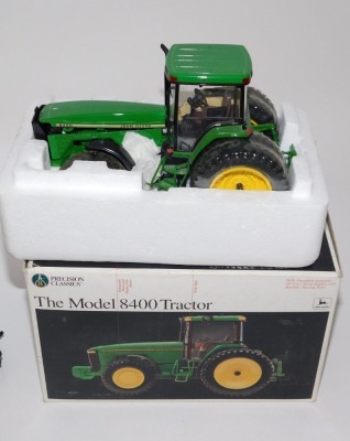 Diecast agricultural vehicles, comprising a Precision Classics model 8400 John Deere tractor, boxed, a Megs Models and Toys Fordson Major E27N with Perkins P6 engine model, boxed, three John Deere tractors and a miniature farm set. (a quantity) - 5