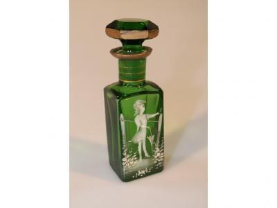 A green glass scent bottle decorated in the manner of Mary Gregory