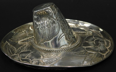 A Mexican style white metal model of a sombrero hat