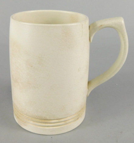 A Wedgwood Keith Murray designed cream glazed mug