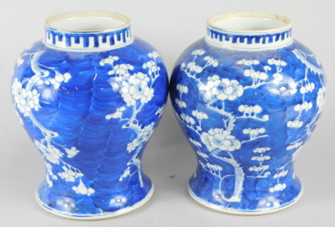 A pair of late 19thC Chinese prunus pattern baluster vases