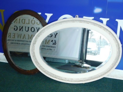 Two oval wall mirrors