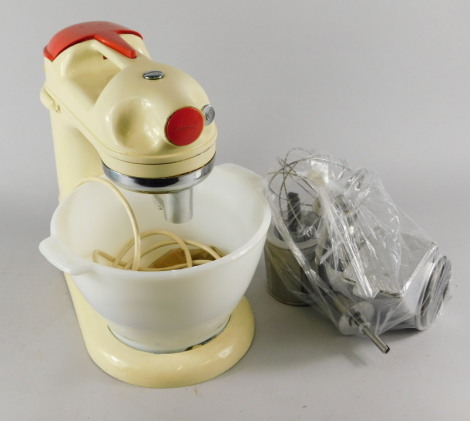 A vintage cream and red painted Kenwood mixer