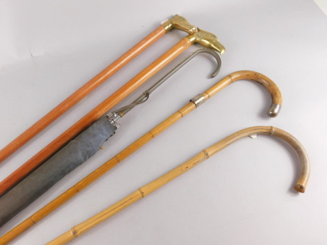 A cane with silver mounted handle